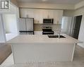 12 Oakmont Drive, Loyalist, ON  - Indoor Photo Showing Kitchen With Double Sink 