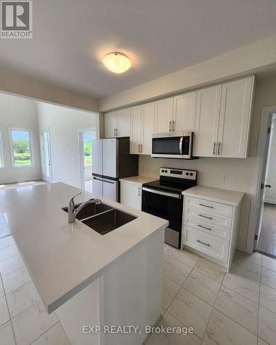 12 Oakmont Drive, Loyalist, ON - Indoor Photo Showing Kitchen With Double Sink