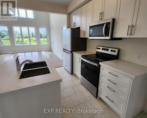 12 Oakmont Drive, Loyalist, ON - Indoor Photo Showing Kitchen With Double Sink