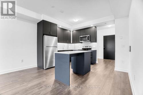 426 - 3200 William Coltson Avenue, Oakville, ON - Indoor Photo Showing Kitchen With Stainless Steel Kitchen