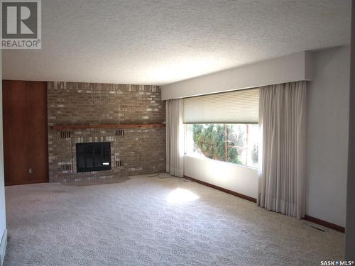 313 21 Highway N, Leader, SK - Indoor Photo Showing Living Room With Fireplace