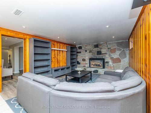 Lower-89 Lingarde Dr, Toronto, ON - Indoor Photo Showing Living Room With Fireplace