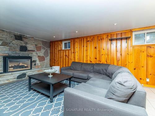 Lower-89 Lingarde Dr, Toronto, ON - Indoor Photo Showing Living Room With Fireplace