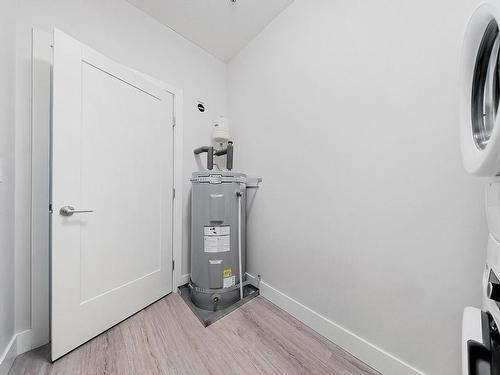 205-6544 Metral Dr, Nanaimo, BC - Indoor Photo Showing Laundry Room