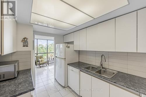 605 - 1111 Bough Beeches Boulevard, Mississauga, ON - Indoor Photo Showing Kitchen With Double Sink