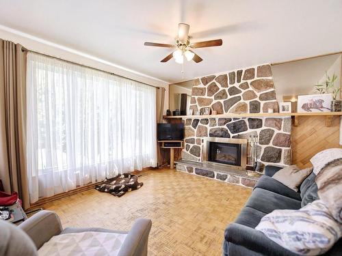 Living room - 1395 Rue De Pontivy, Terrebonne (Terrebonne), QC - Indoor Photo Showing Living Room With Fireplace