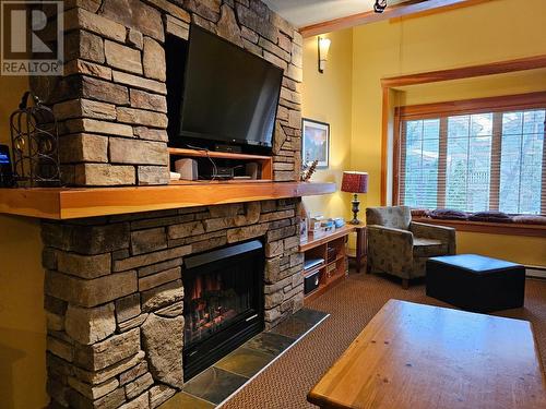 41 Rivermount  Place Unit# 103, Fernie, BC - Indoor Photo Showing Living Room With Fireplace