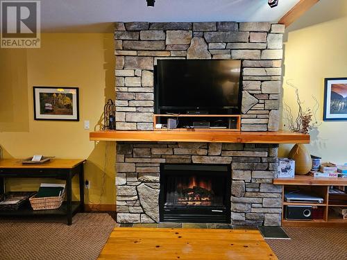 41 Rivermount  Place Unit# 103, Fernie, BC - Indoor Photo Showing Living Room With Fireplace