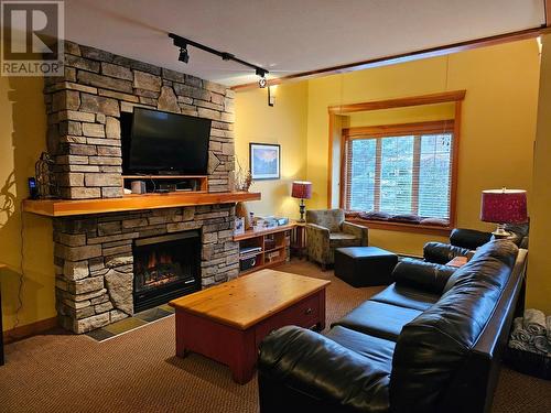 41 Rivermount  Place Unit# 103, Fernie, BC - Indoor Photo Showing Living Room With Fireplace