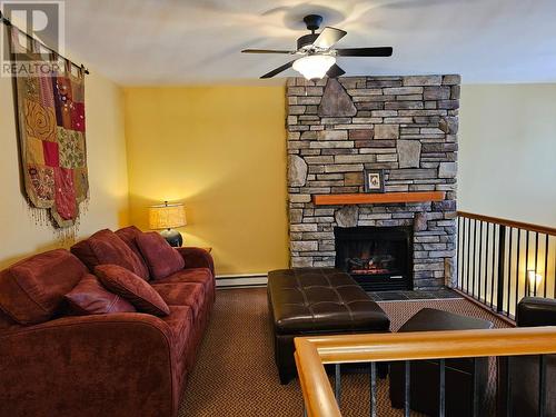 41 Rivermount  Place Unit# 103, Fernie, BC - Indoor Photo Showing Living Room With Fireplace