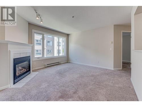 3320 Centennial Drive Unit# 209, Vernon, BC - Indoor With Fireplace