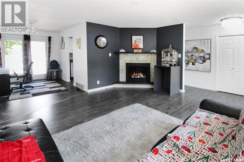 229 6Th Avenue Nw, Swift Current, SK - Indoor Photo Showing Living Room With Fireplace