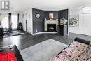 229 6Th Avenue Nw, Swift Current, SK  - Indoor Photo Showing Living Room With Fireplace 