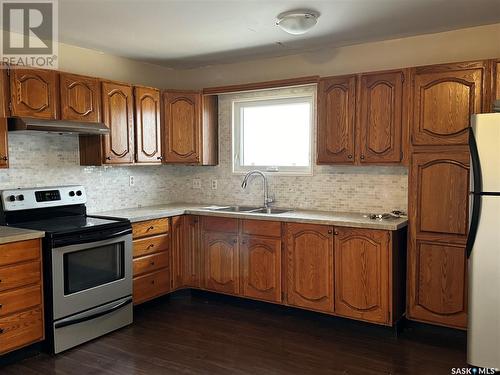 243 Dominion Road, Assiniboia, SK - Indoor Photo Showing Kitchen With Double Sink