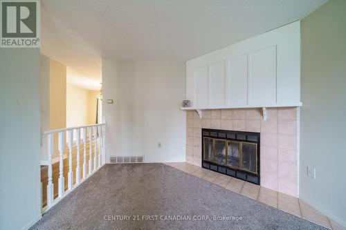 495 Springbank Avenue, Woodstock, ON - Indoor Photo Showing Living Room With Fireplace