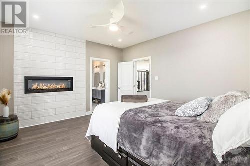 209 Des Violettes Street, Hammond, ON - Indoor Photo Showing Bedroom With Fireplace