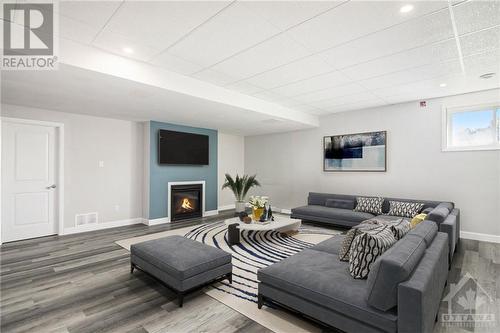 209 Des Violettes Street, Hammond, ON - Indoor Photo Showing Living Room With Fireplace