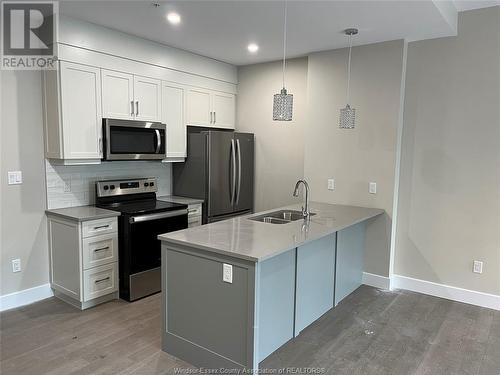 140 Main Street East Unit# 102, Kingsville, ON - Indoor Photo Showing Kitchen With Stainless Steel Kitchen With Double Sink With Upgraded Kitchen