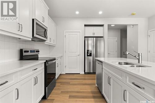 3296 Favel Drive, Regina, SK - Indoor Photo Showing Kitchen With Stainless Steel Kitchen With Double Sink With Upgraded Kitchen