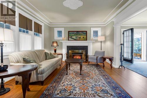 16 Nelles Boulevard, Grimsby, ON - Indoor Photo Showing Living Room With Fireplace