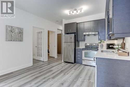 310 - 8228 Birchmount Road, Markham, ON - Indoor Photo Showing Kitchen With Double Sink