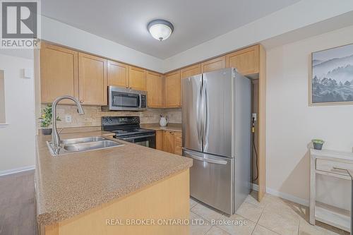 1 - 580 Shoreline Drive, Mississauga, ON - Indoor Photo Showing Kitchen With Double Sink