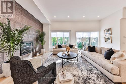 3 Arbourvale, St. Catharines, ON - Indoor Photo Showing Living Room With Fireplace