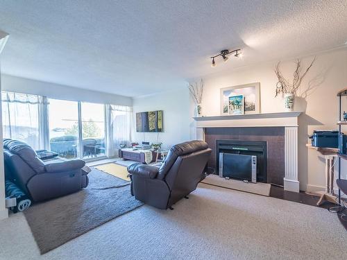 111-2562 Departure Bay Rd, Nanaimo, BC - Indoor Photo Showing Living Room With Fireplace