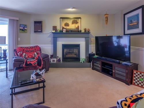 303-1750 Atkinson Street, Penticton, BC - Indoor Photo Showing Living Room With Fireplace