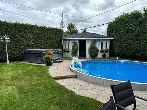 Backyard - 911 Av. Du Terroir, Terrebonne (Lachenaie), QC - Outdoor With Above Ground Pool With Backyard