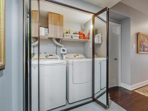 Salle de lavage - 801-4500 Ch. Des Cageux, Laval (Chomedey), QC - Indoor Photo Showing Laundry Room