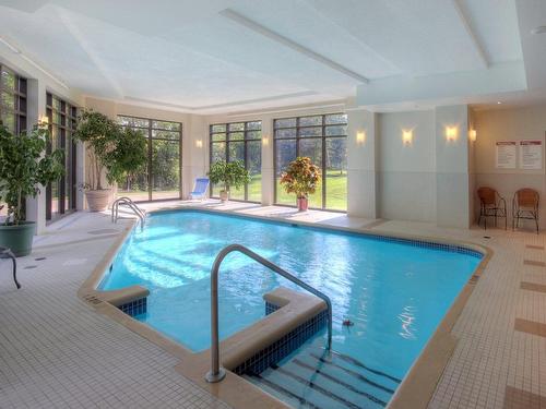 Piscine - 801-4500 Ch. Des Cageux, Laval (Chomedey), QC - Indoor Photo Showing Other Room With In Ground Pool