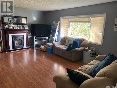 319 Alberta Avenue, Kerrobert, SK - Indoor Photo Showing Living Room With Fireplace