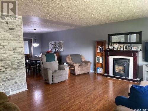 319 Alberta Avenue, Kerrobert, SK - Indoor Photo Showing Living Room With Fireplace