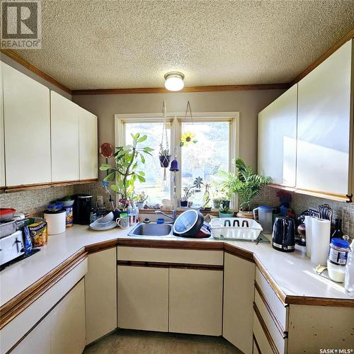 317 Montreal Street, Melville, SK - Indoor Photo Showing Kitchen With Double Sink