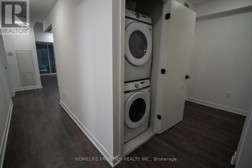 211 - 36 Zorra Street, Toronto, ON - Indoor Photo Showing Laundry Room