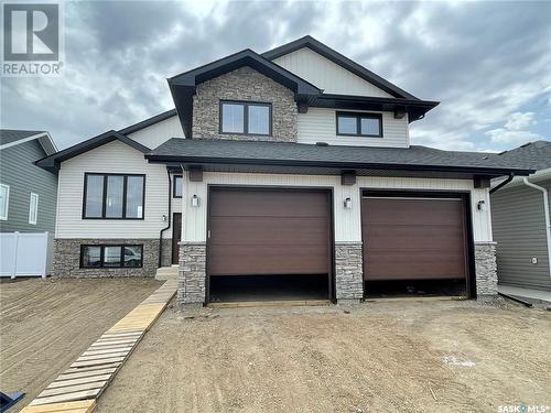 819 Woods Crescent, Warman, SK - Outdoor With Facade