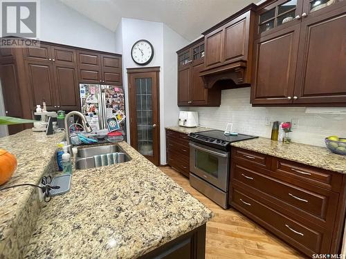 212 4Th Avenue E, Kindersley, SK - Indoor Photo Showing Kitchen With Double Sink