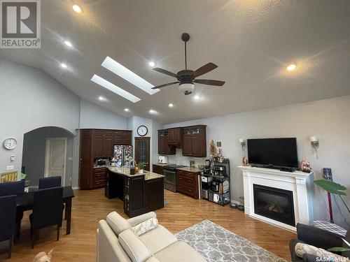 212 4Th Avenue E, Kindersley, SK - Indoor Photo Showing Living Room With Fireplace