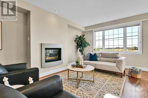 Living Room With Gas Fireplace - 1326 Kingston Avenue, Ottawa, ON - Indoor Photo Showing Living Room With Fireplace