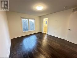 Spare room with dark hardwood / wood-style floors - 