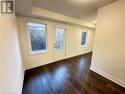 Entryway with dark hardwood / wood-style flooring - 