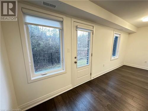 Doorway to outside featuring dark hardwood / wood-style flooring and a healthy amount of sunlight - 258 Hespeler Rd Road Unit# 36, Cambridge, ON - Indoor Photo Showing Other Room