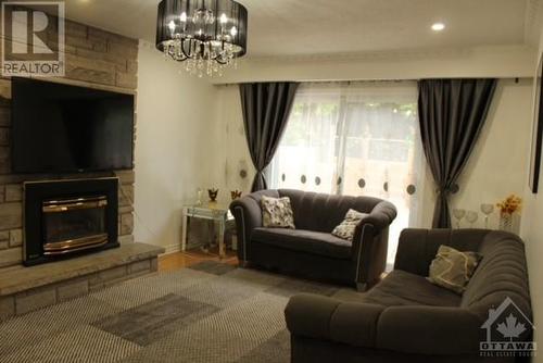 2007 Tawney Road, Ottawa, ON - Indoor Photo Showing Living Room With Fireplace