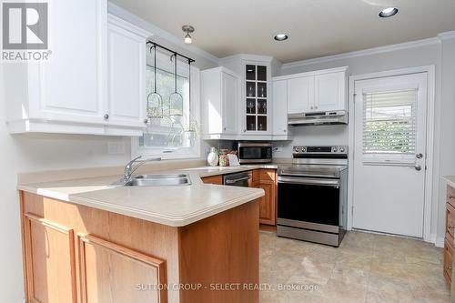 Side entry, behind the garage - 994 Quinton Place, London, ON - Indoor Photo Showing Kitchen With Double Sink