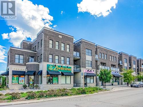 128 Burnhamthorpe Road E, Oakville, ON - Outdoor With Facade