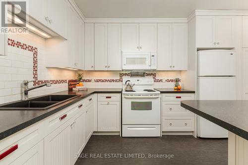 108 - 7 Thornwood Road, Toronto, ON - Indoor Photo Showing Kitchen With Double Sink