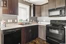 5417 Mcclelland Drive, Regina, SK  - Indoor Photo Showing Kitchen With Double Sink 