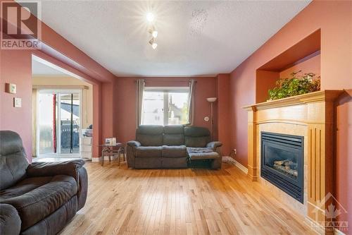 16 Manoir Street, Embrun, ON - Indoor Photo Showing Living Room With Fireplace