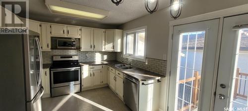 1202 Butterfield Crescent N, Regina, SK - Indoor Photo Showing Kitchen With Double Sink